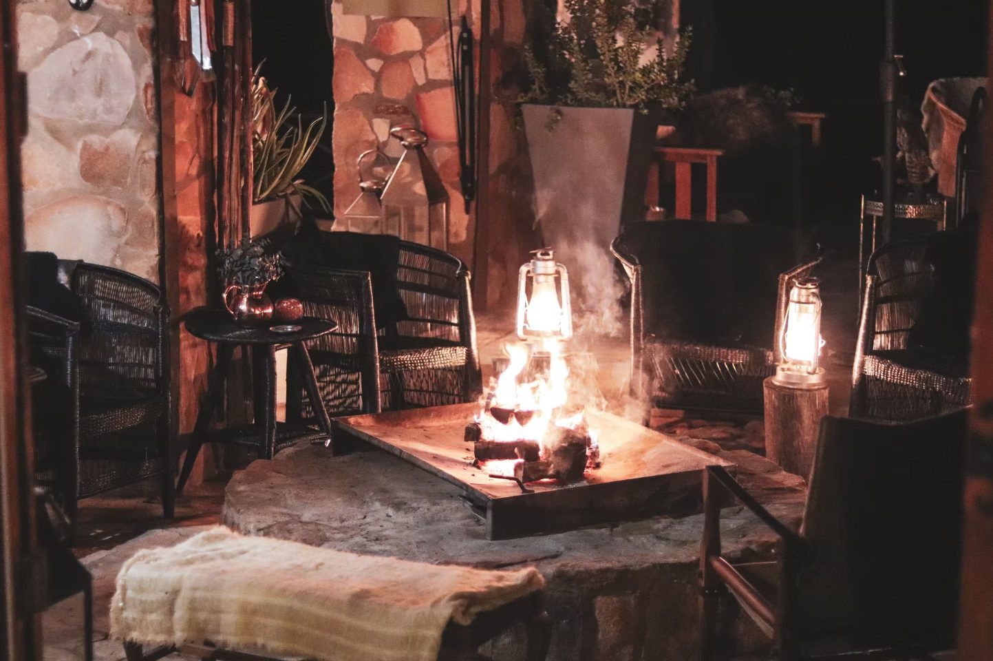 Lantern-lit fireside lounge at Doringbos after dark